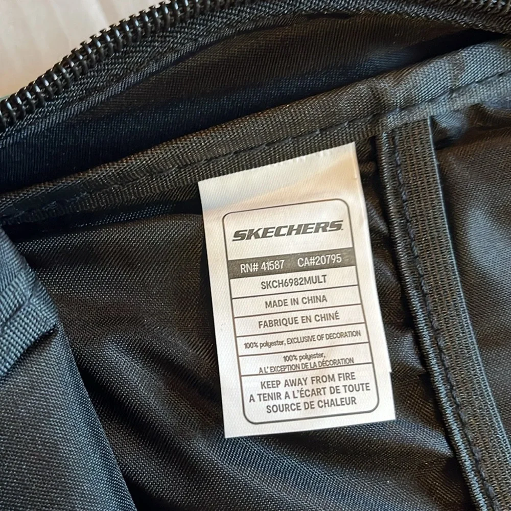 NWT-Skechers-black with multi floral back pack.metal zippers.unisex